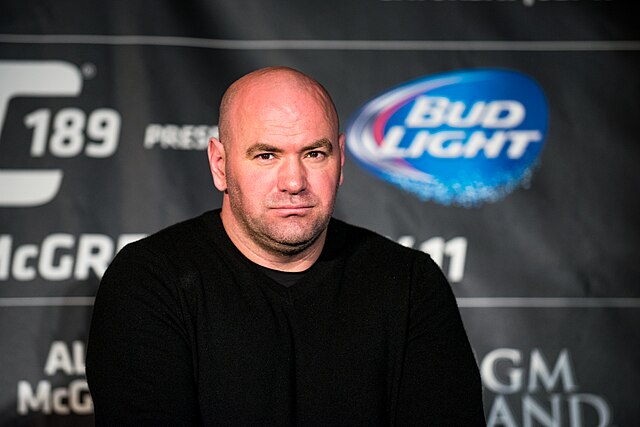 Dana White at UFC event in 2015; UFC 319 features eight veteran fighters over 37 including Barboza, Cannonier, and Page